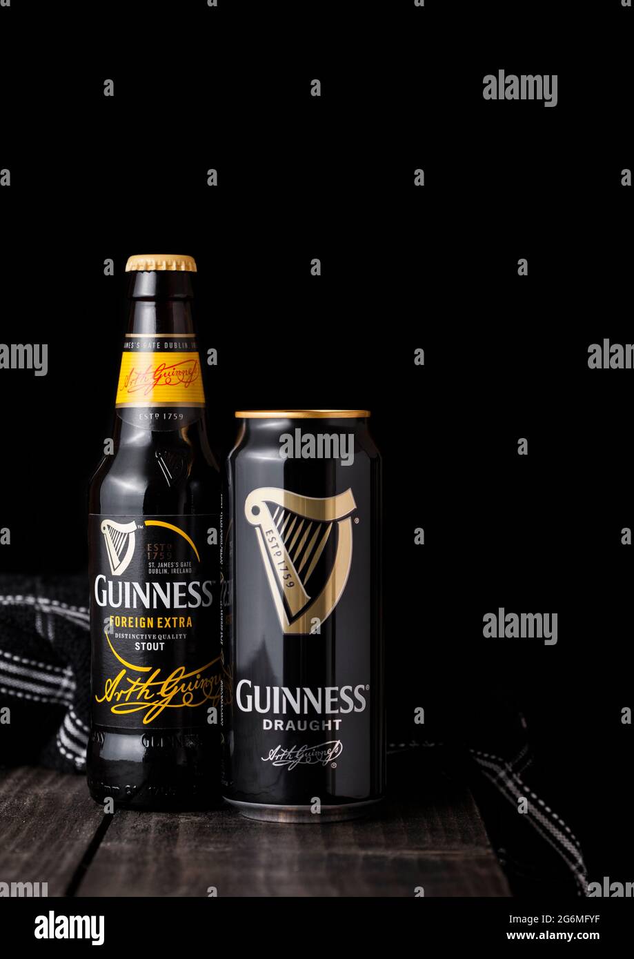 LONDON, UK APRIL 27, 2018 Bottle and aluminium cans of Guinness