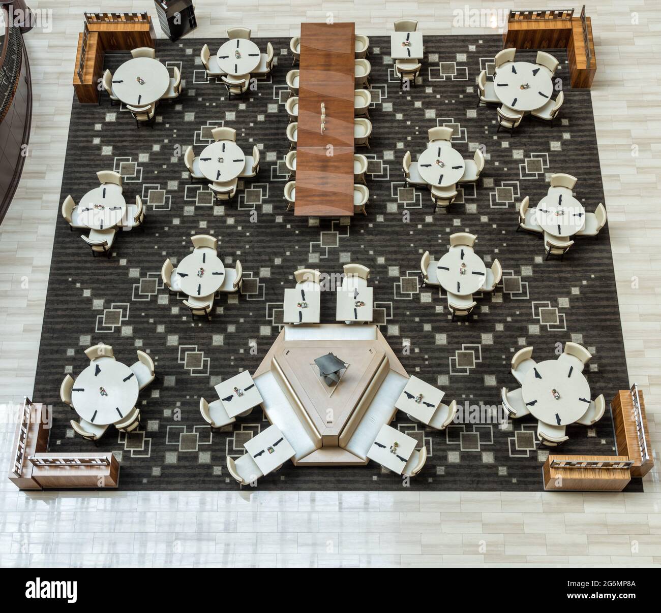 Aerial view above a hotel restaurant or cafe tables with no people due to coronavirus restrictions Stock Photo