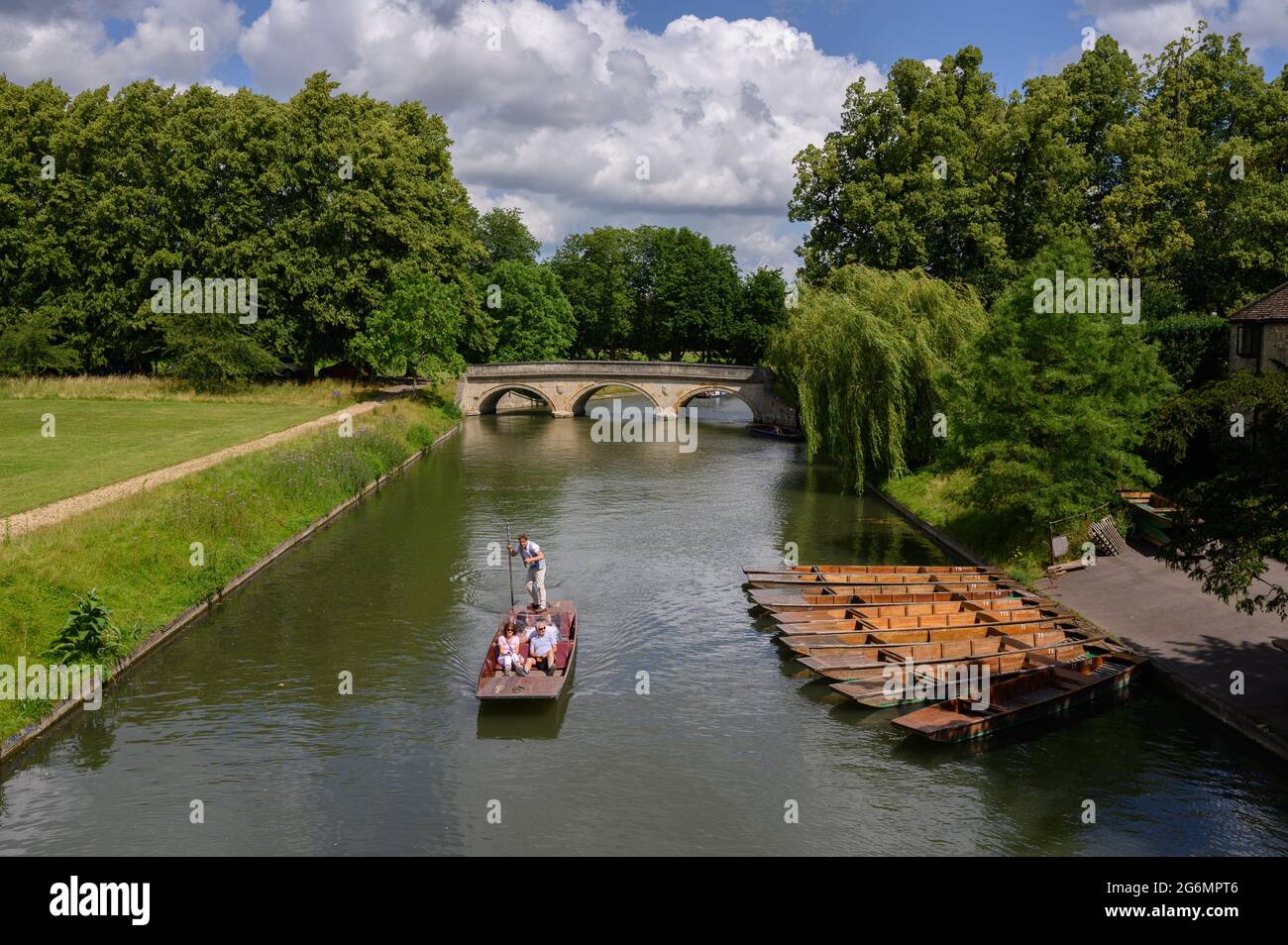 Punting on the River Cam in Cambridge, England, with Trinity Bridge in the background. Stock Photo