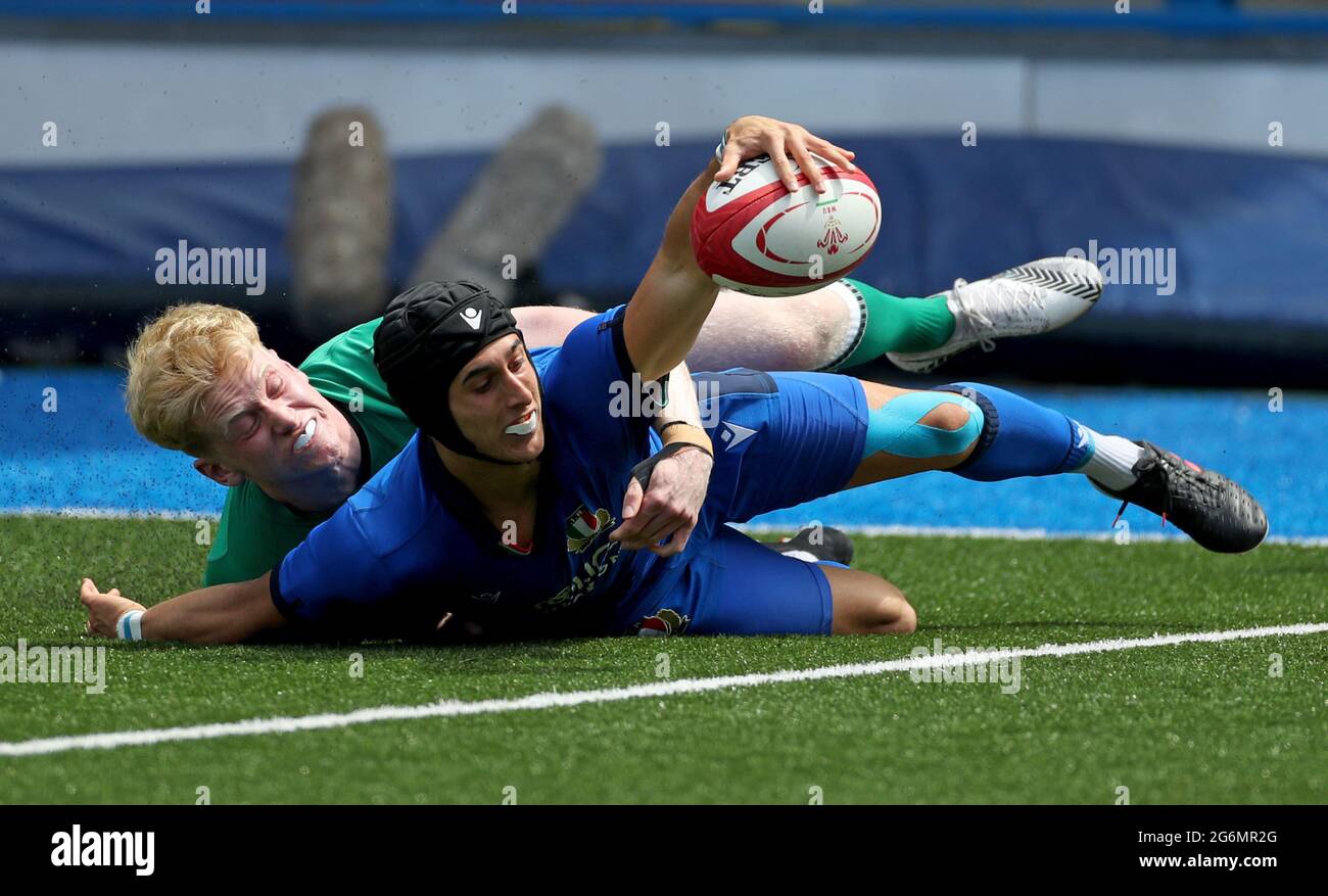 Italy’s Gesi Simone scores a try as he is tackled by Ireland’s Jamie Osborne during the Under 20s Six Nations match at Cardiff Arms Park, Cardiff. Picture date: Wednesday July 7, 2021. Stock Photo