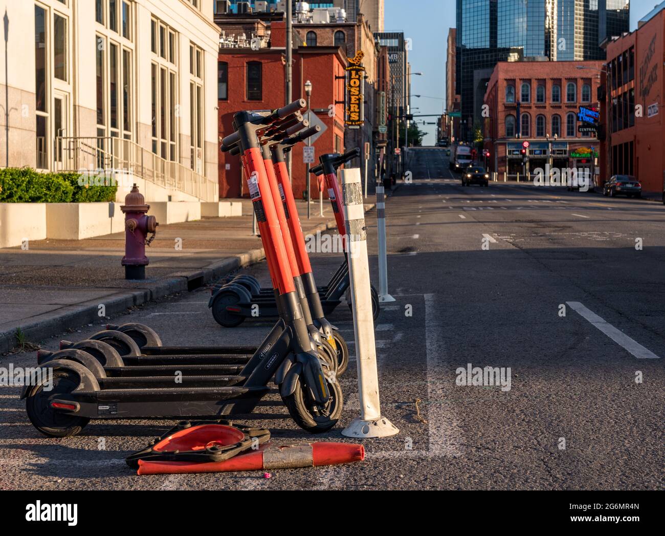 Nashville, Tennessee - 28 June 2021: Spin electric scooter on roadside near Broadway and downtown entertainment Stock Photo