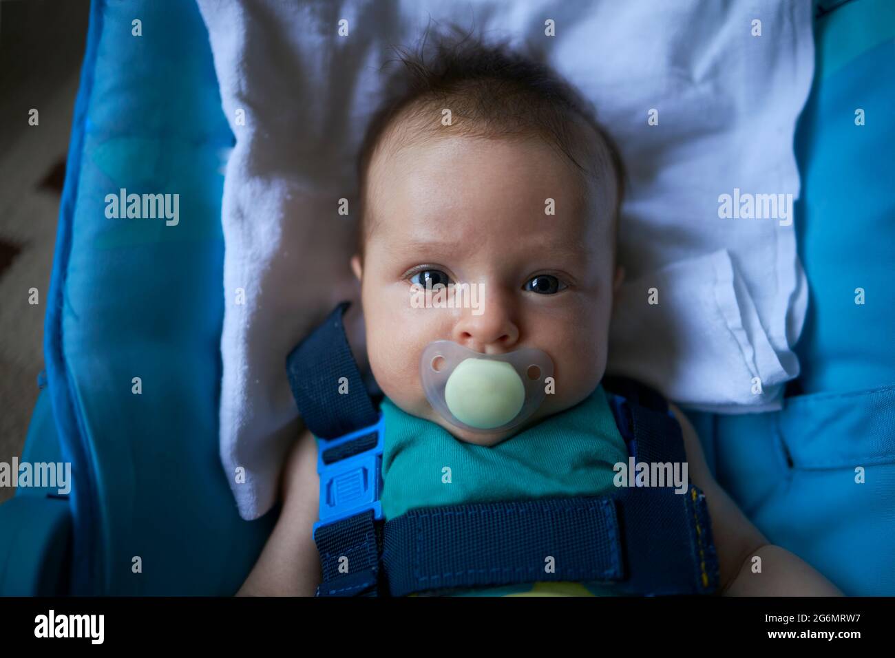 Small baby with a pacifier Stock Photo