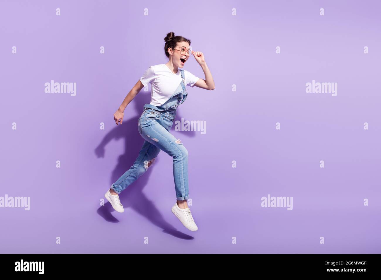 Full length profile side photo of young girl happy smile jump go walk ...