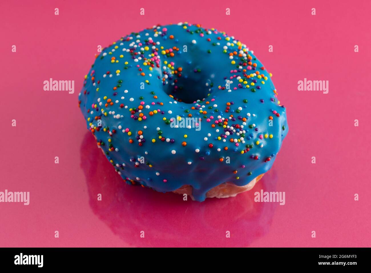 A Blue Glazed Donut with Rainbow Sprinkles on Top Stock Photo - Alamy
