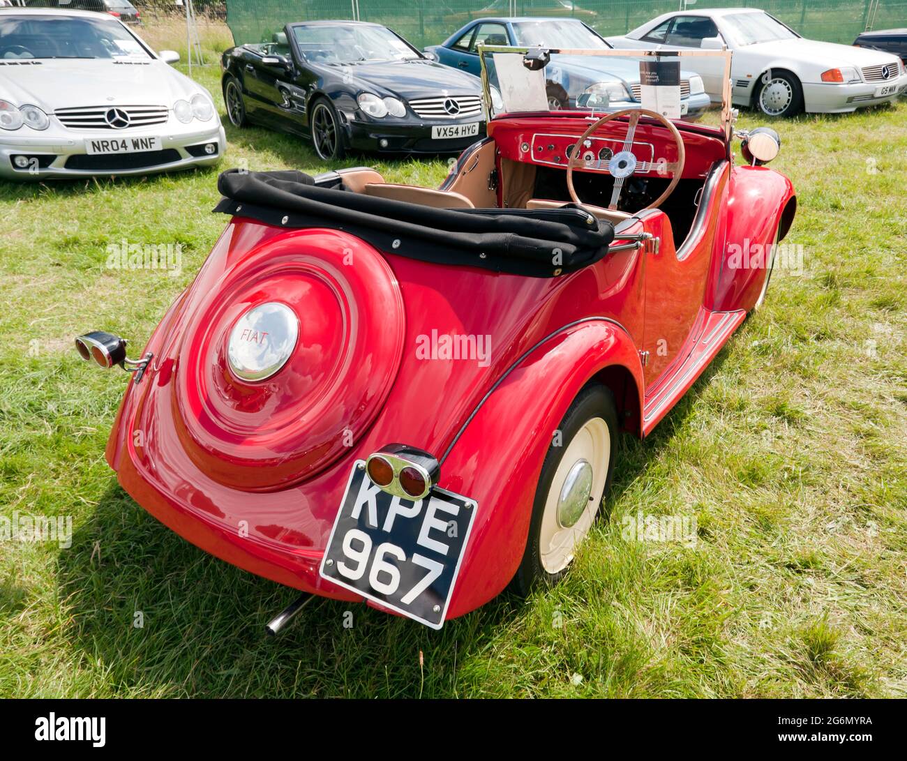 View of a Red,  1938 Fiat 500 Topolino Smith Special, for auction, at the 2021 London Classic Car Show Stock Photo