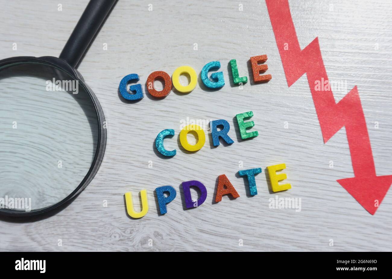 Google core update text with colorful letters with a red arrow and magnifying glass. Search engine optimization SEO, Digital Marketing term for Google Stock Photo