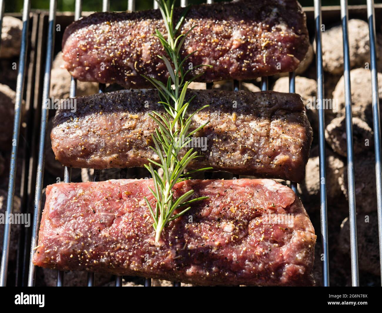 Rosemary lamb steaks with garlic Stock Photo Alamy