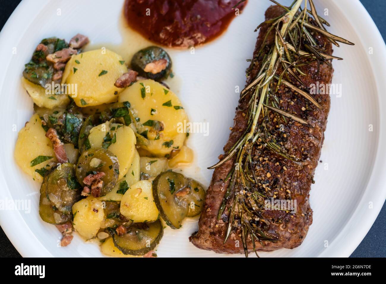 Rosemary lamb steaks with garlic Stock Photo Alamy