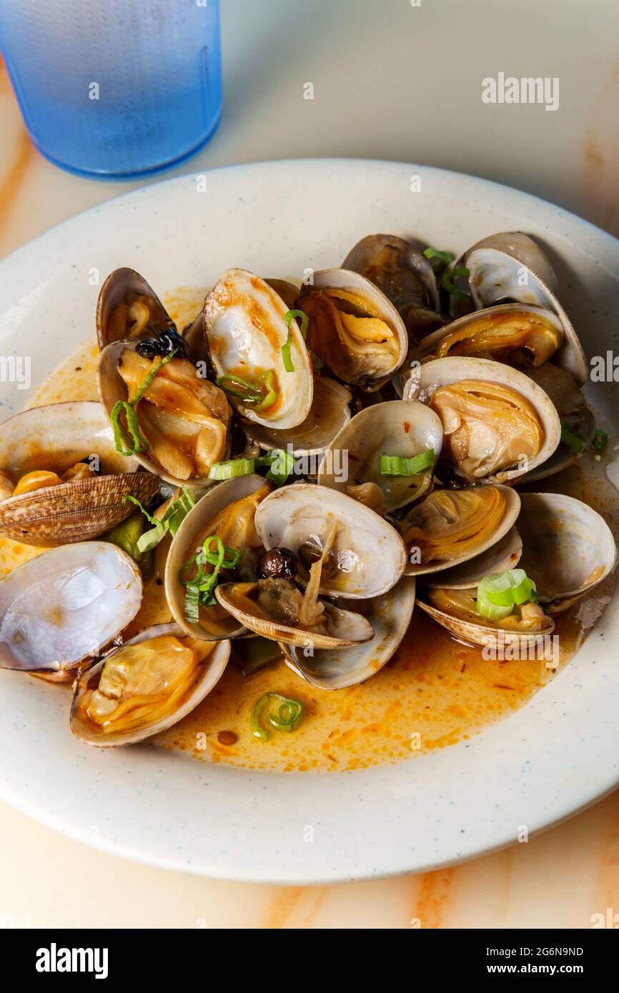 Chinese clams with black bean sauce garnished with green onions Stock Photo Alamy