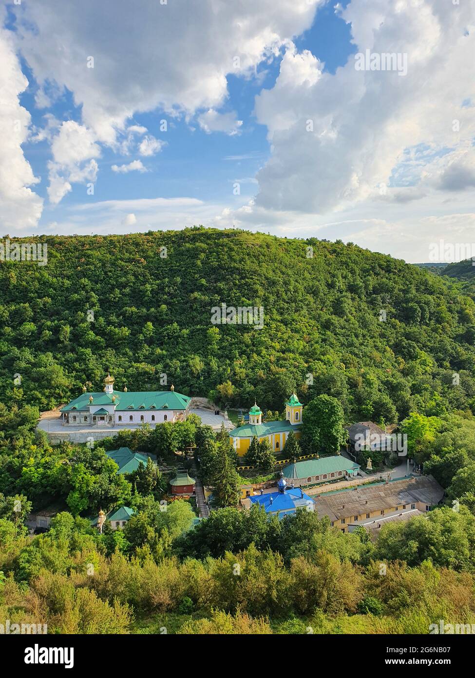 High angle view from altitude to the Saharna Monastery, Moldova. Idyllic place with the church in the middle of woods on the gorge valley Stock Photo