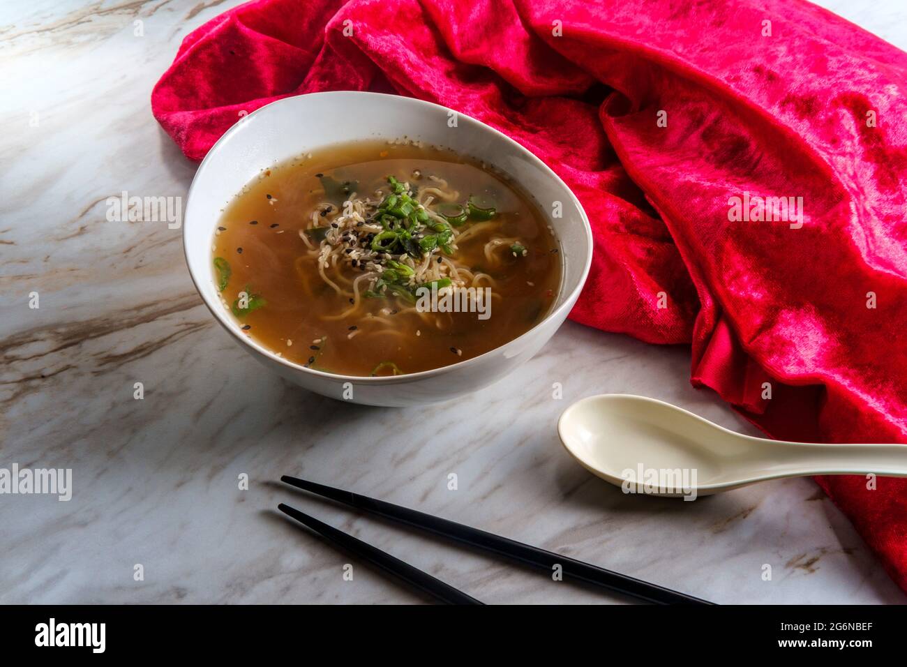 Japanese miso ramen noodle soup with tuxedo sesame seeds and sliced