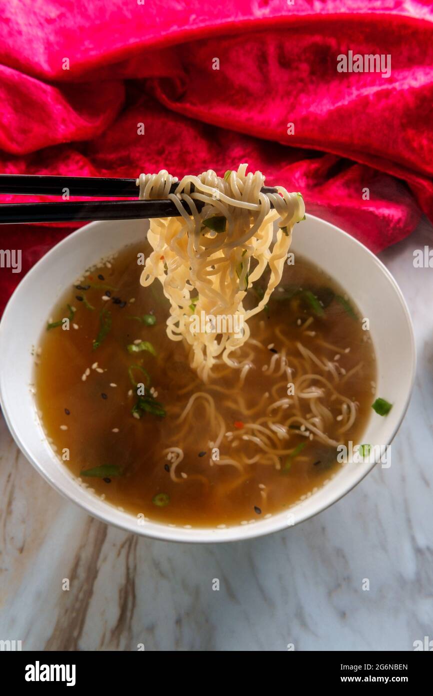 Japanese miso ramen noodle soup with tuxedo sesame seeds and sliced