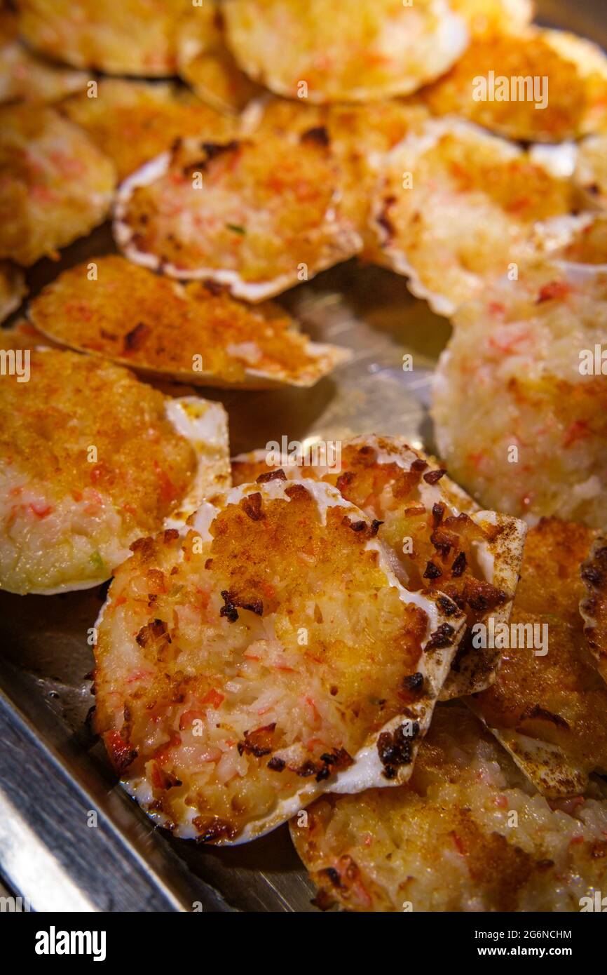Cheesy stuffed clams in catering or buffet server tray Stock Photo