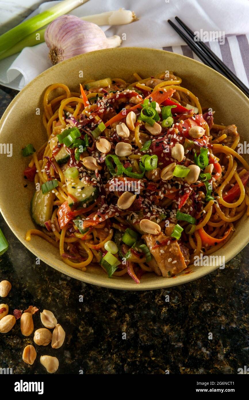 Spicy Thai chicken peanut butter lo mein noodles with tuxedo sesame