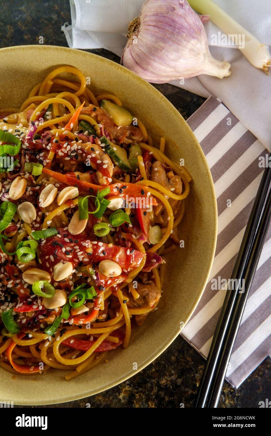 Spicy Thai chicken peanut butter lo mein noodles with tuxedo sesame