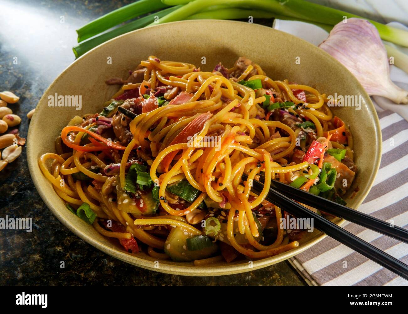 Spicy Thai chicken peanut butter lo mein noodles with tuxedo sesame