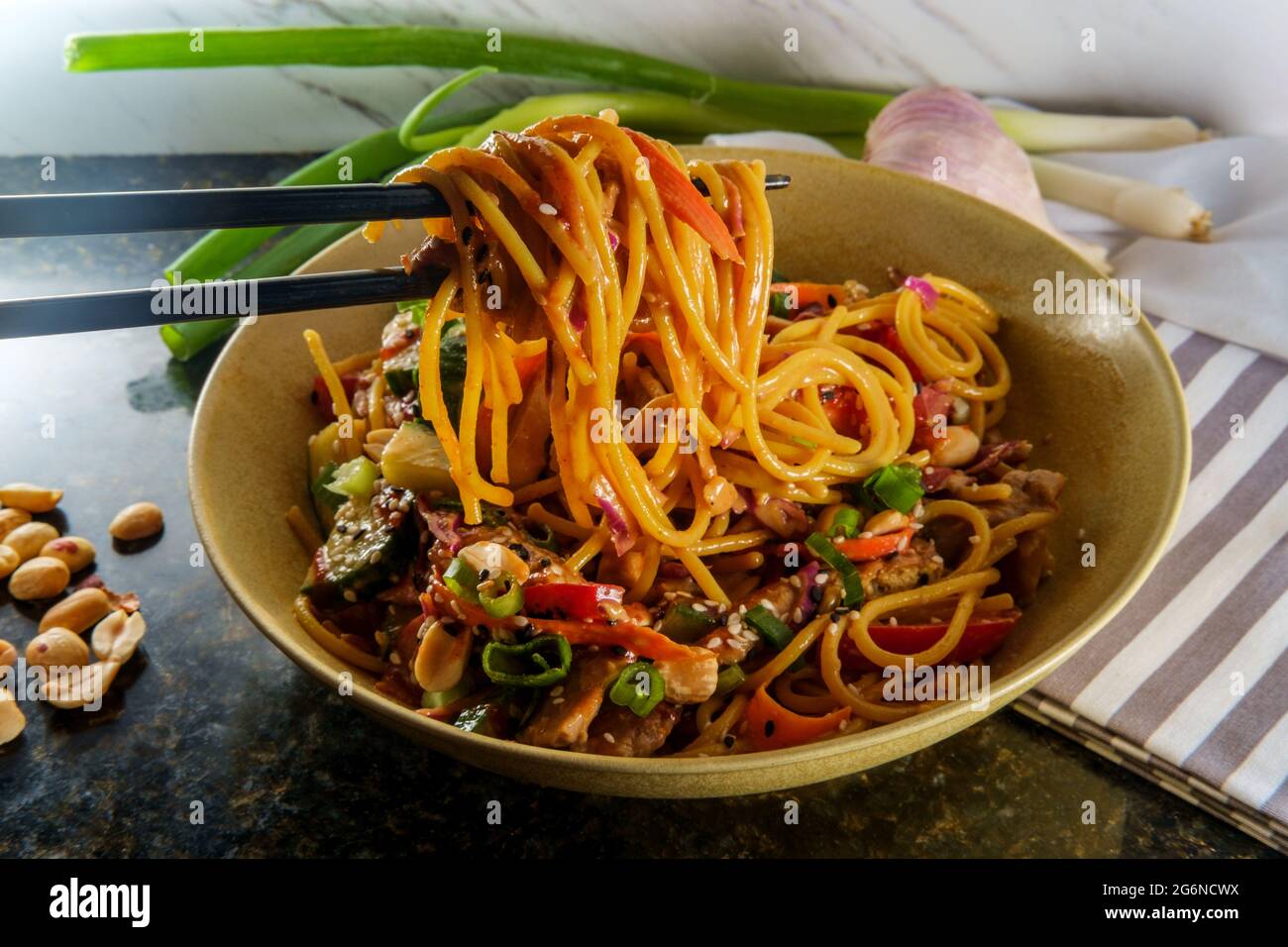 Spicy Thai chicken peanut butter lo mein noodles with tuxedo sesame