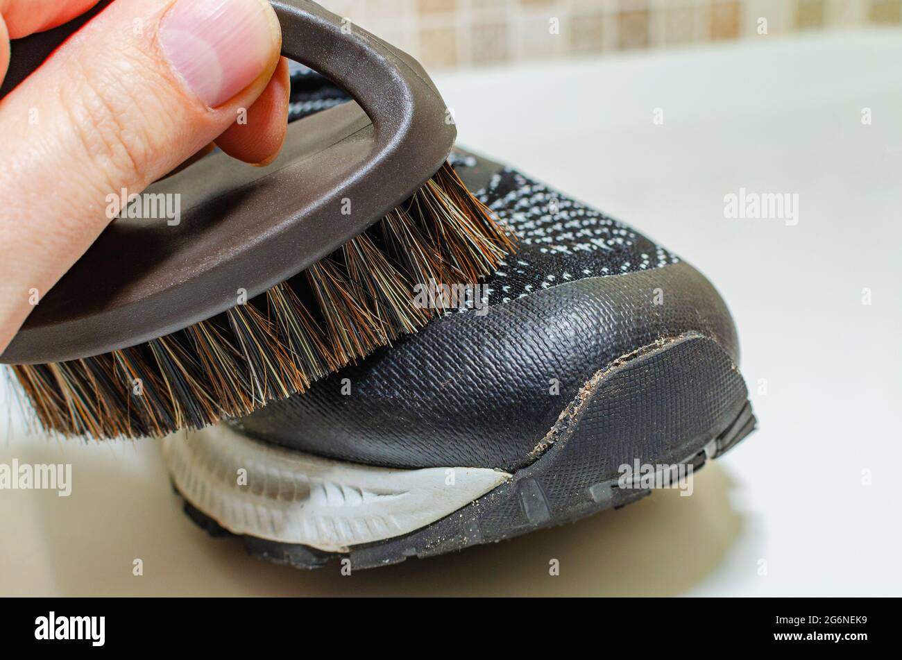 Cleaning dirty sneakers after training. Wash dirty sneakers. Wash your sneakers. Cleaning your
