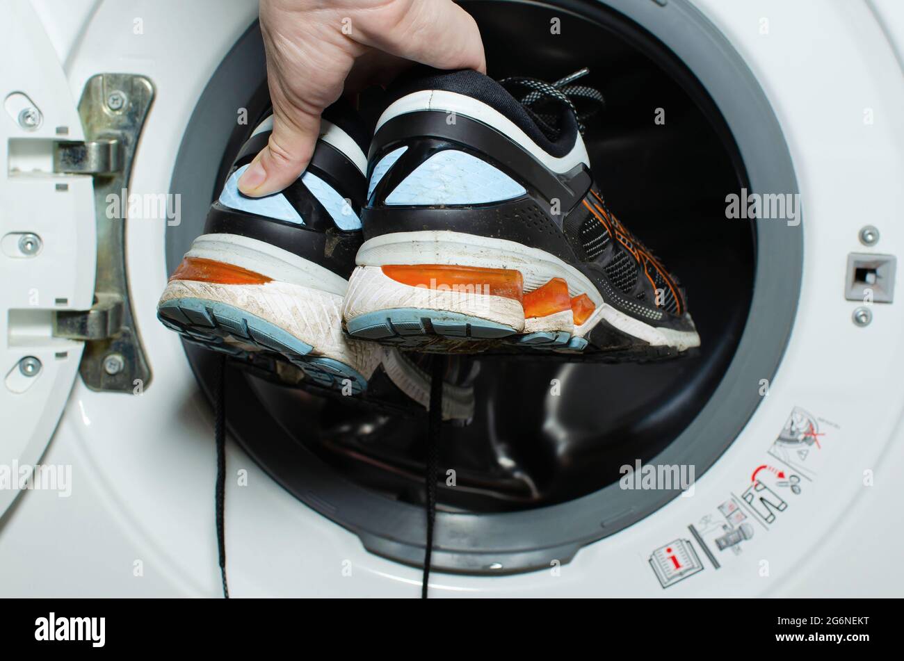 Washing dirty sneakers in the washing machine. Cleaning the your running shoe. Wash dirty sneakers, clean shoes. wash sneakers. cleaning trail Stock Photo - Alamy