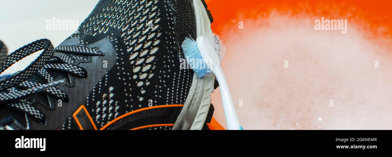 Washing dirty sneakers. Cleaning the sole of your running shoe. Wash dirty  sneakers, clean shoes. wash sneakers. cleaning trail running shoes Stock  Photo - Alamy