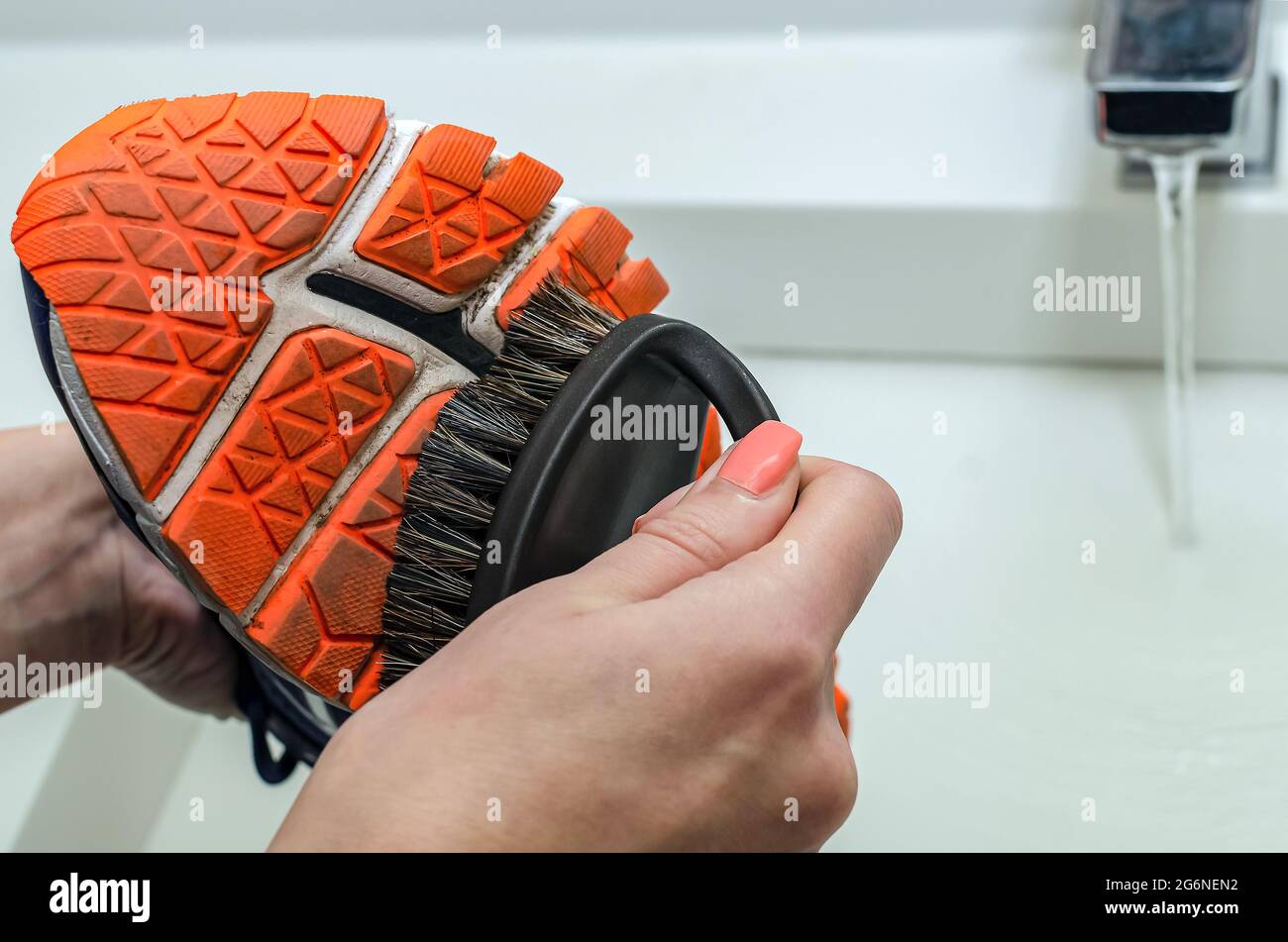 Cleaning dirty sneakers after training. Wash dirty sneakers. Wash your