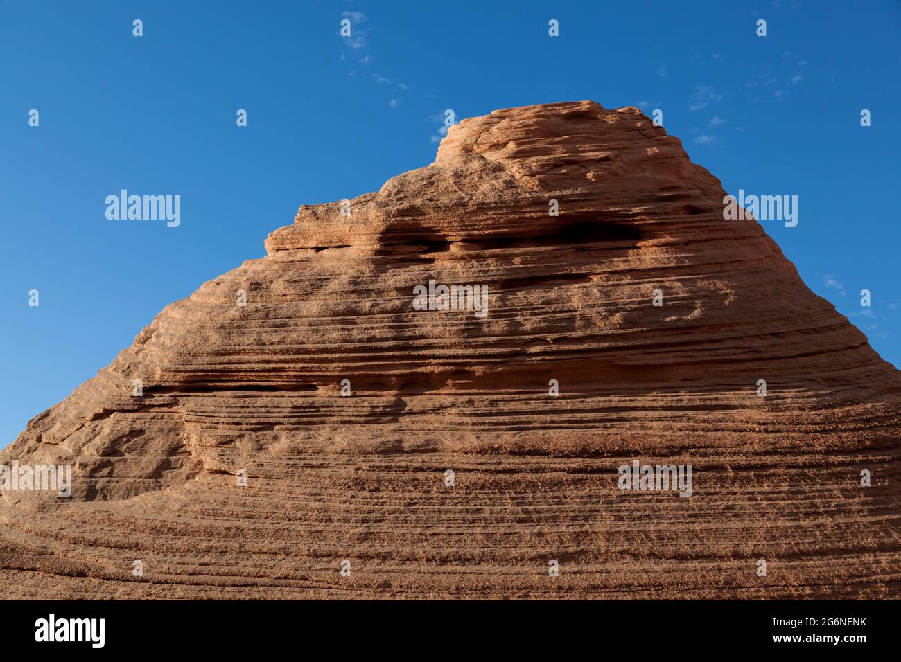 Use your imagination to find the famous face in this eroded sandstone hill at the Page Shores Amphitheater near Page, Arizona. Stock Photo