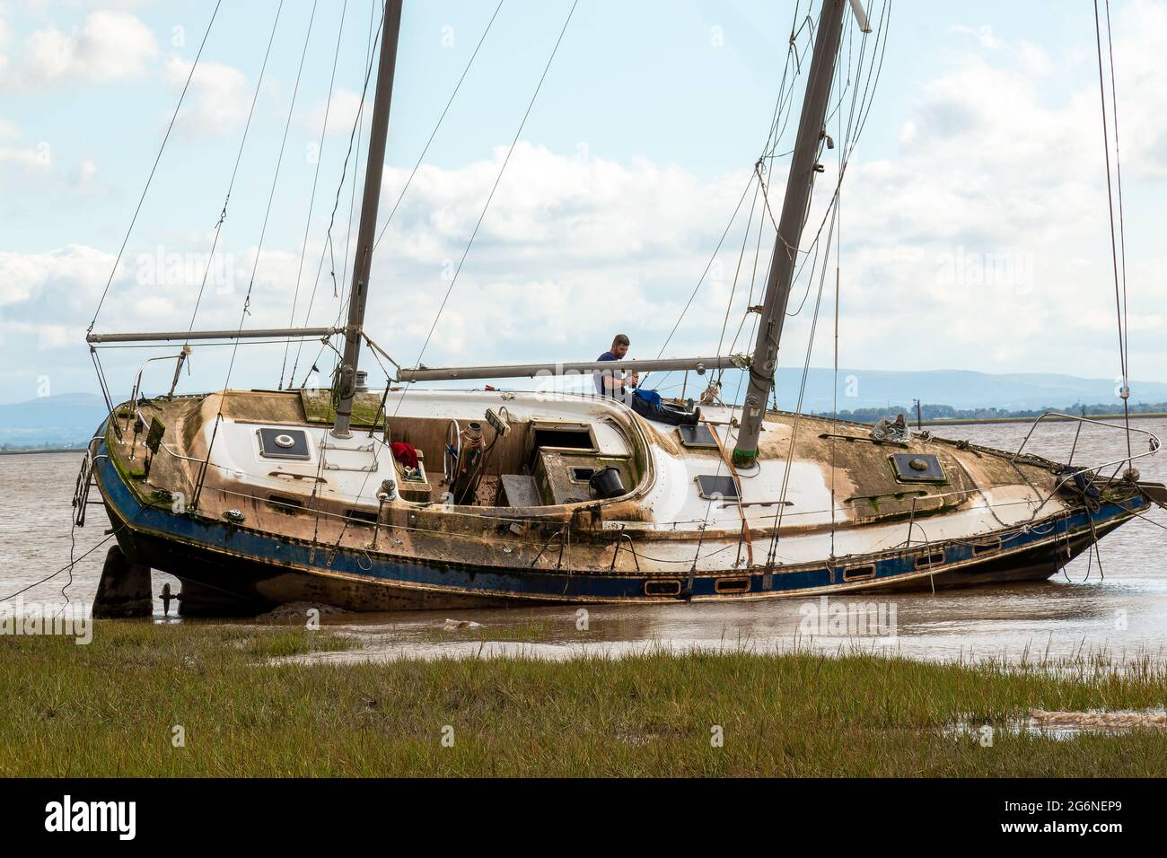 stranded sailing yacht run aground on the shoreline Stock Photo Alamy