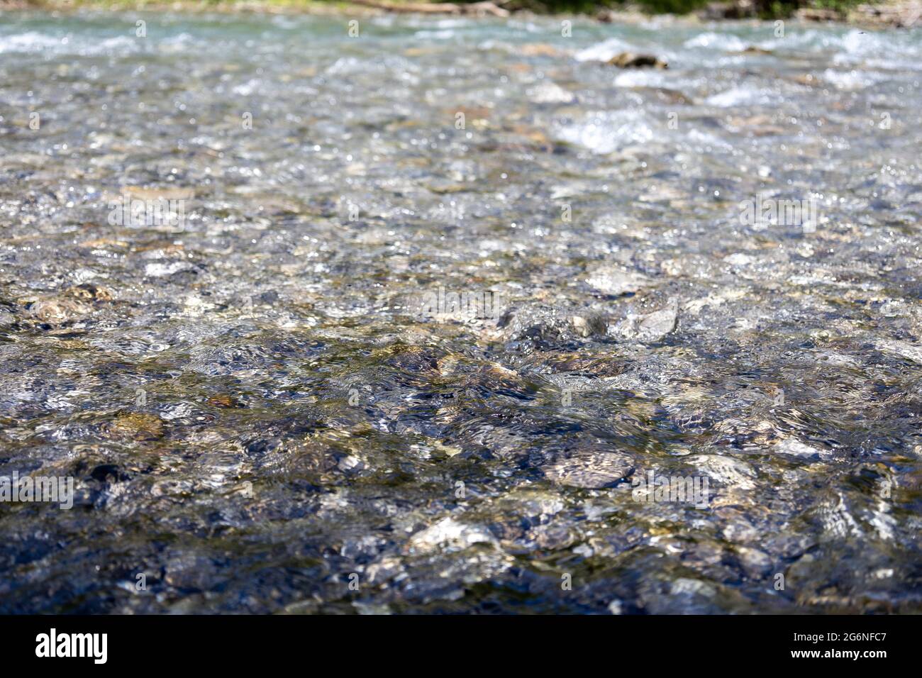 Flowing river with rocks Stock Photo - Alamy