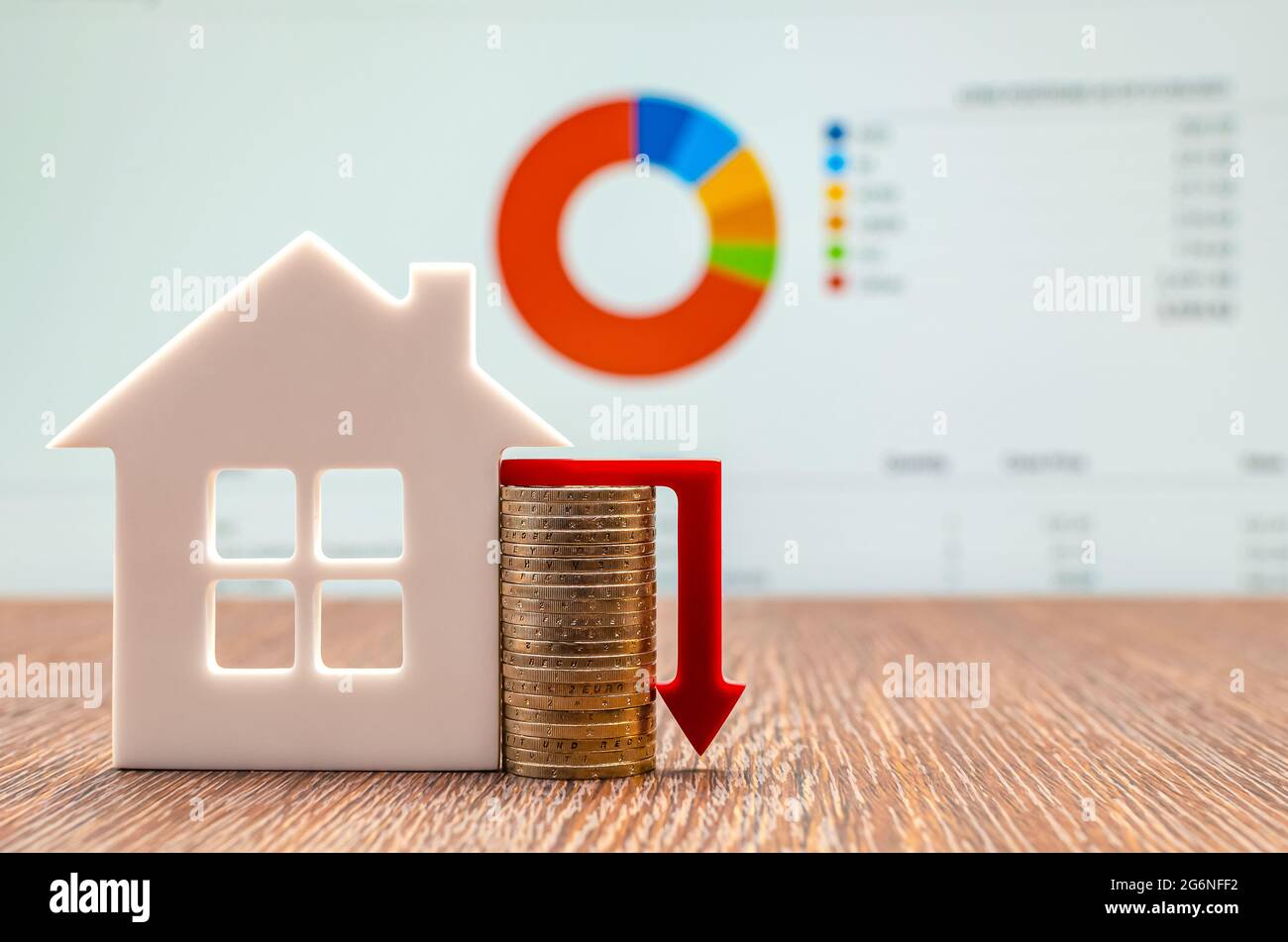 Housing market concept image with graph and down arrow, real estate