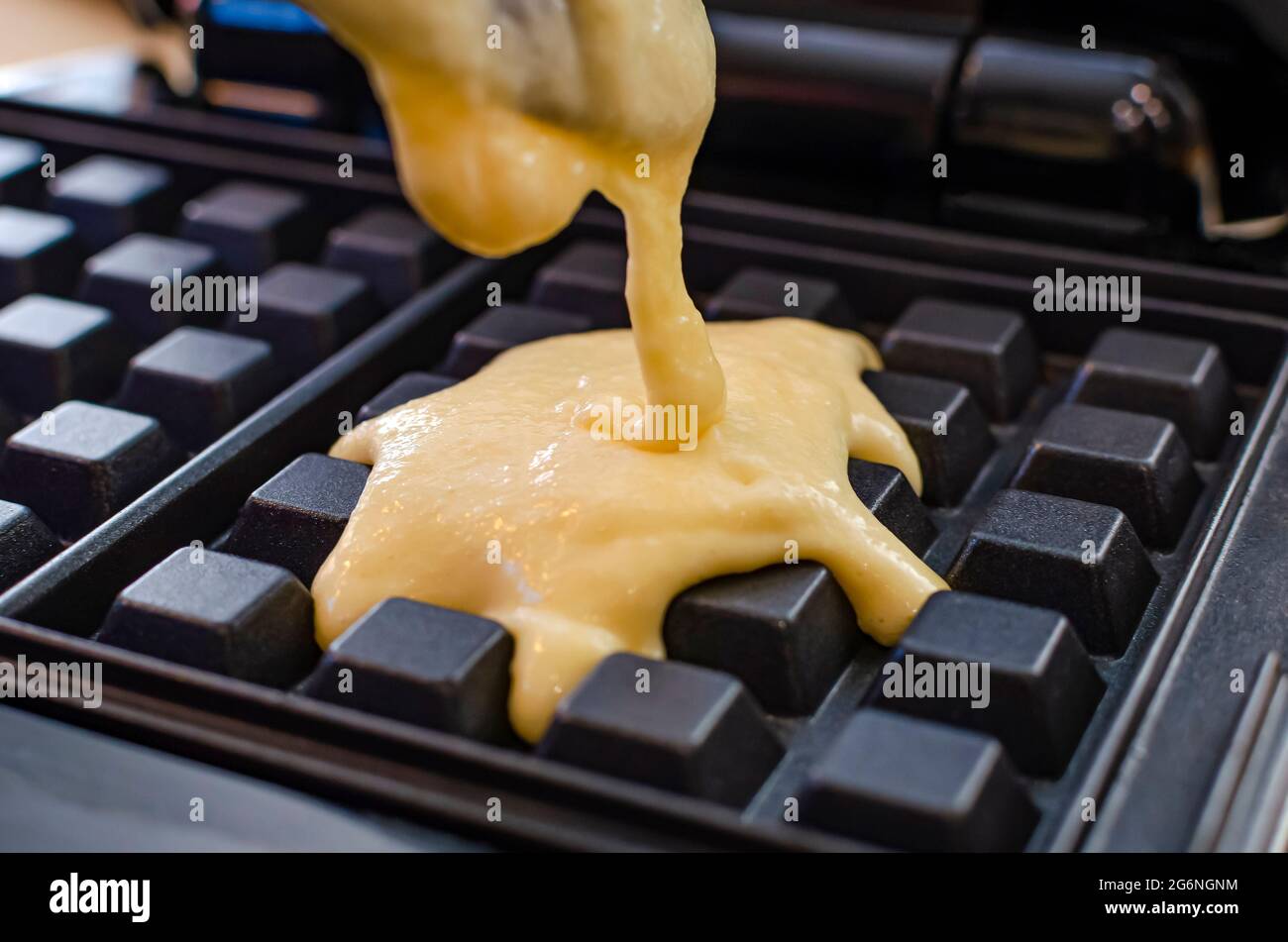 The process of making waffles. Belgian waffles cooking process Stock