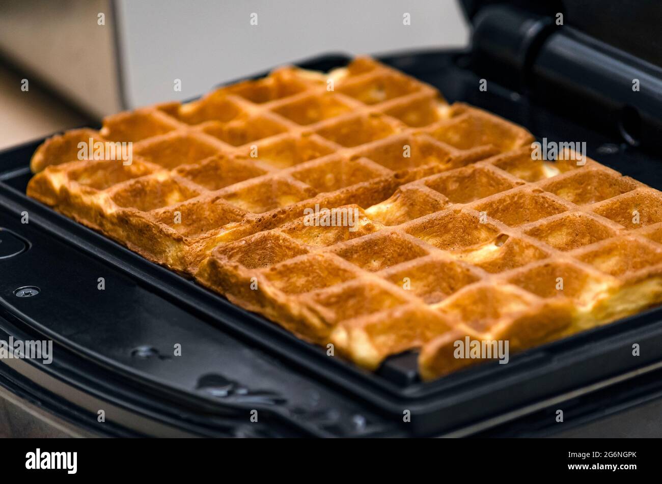 The process of making waffles. Belgian waffles cooking process Stock Photo Alamy