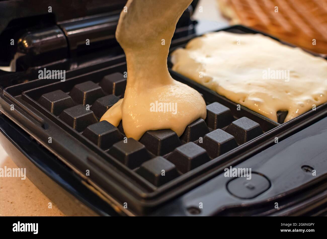 The process of making waffles. Belgian waffles cooking process Stock Photo Alamy