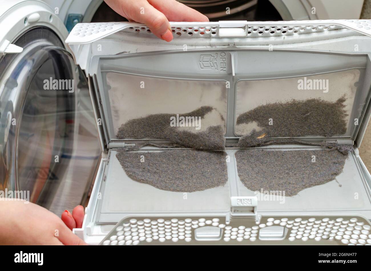 Cleaning the dryer filter. Dryer filter, retains dust and dirt. Dust