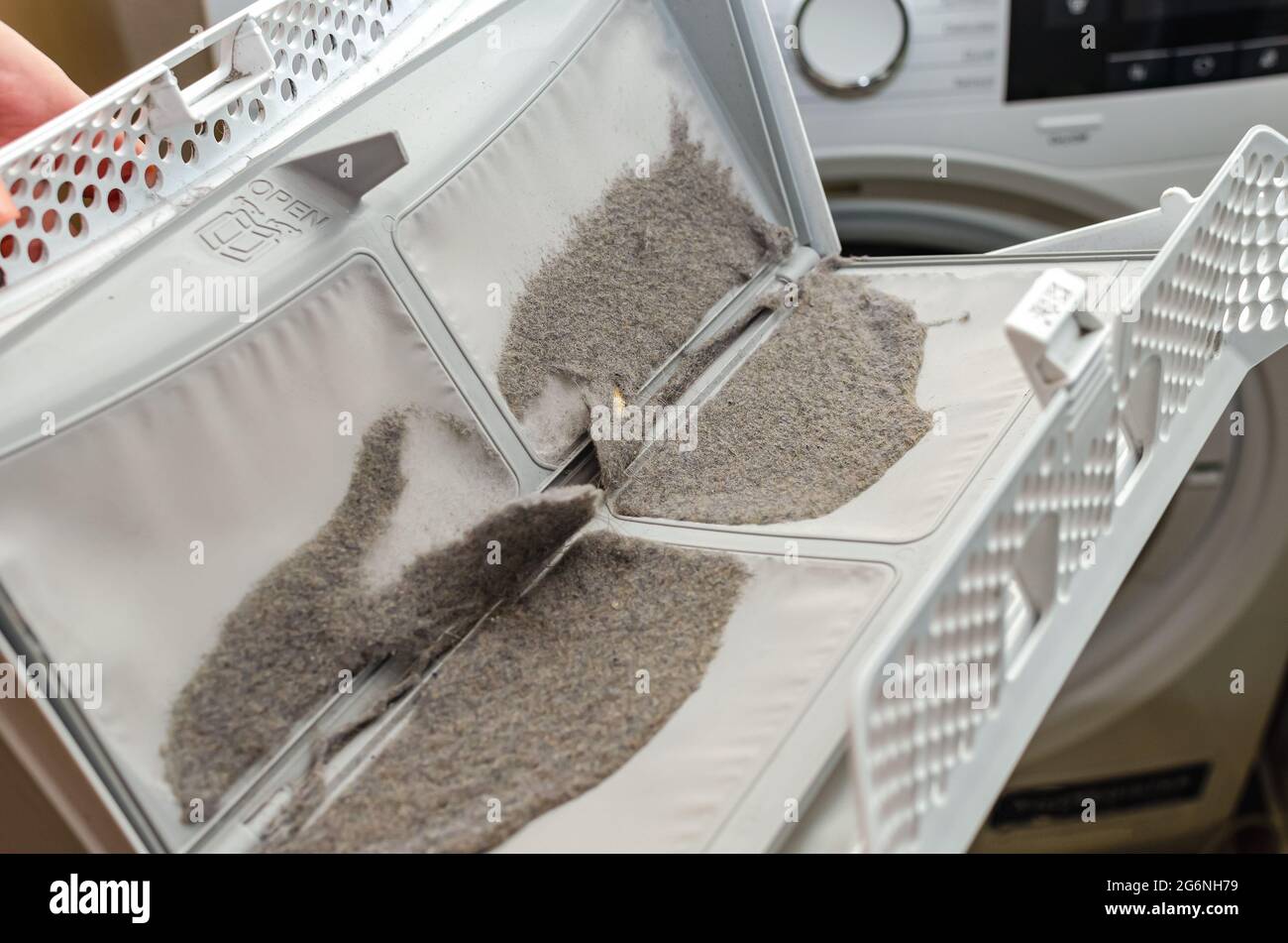 Cleaning the dryer filter. Dryer filter, retains dust and dirt. Dust