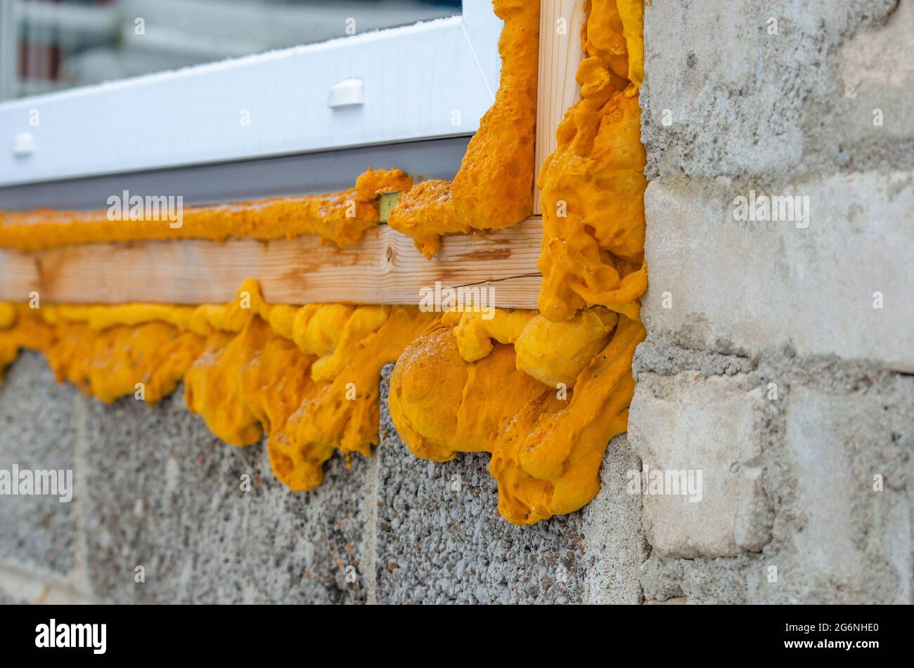 Construction foam. Foam of a stroiteln at a window. Dry foam at a window Stock Photo Alamy