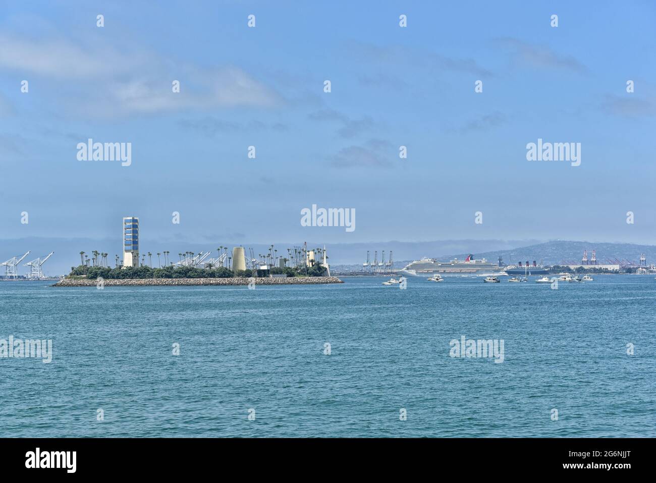 LONG BEACH, CALIFORNIA - 5 JULY 2021: Island White seem from the Belmont Veterans Memorial Pier, with the Queen Mary and Crusie Ship in the Background Stock Photo
