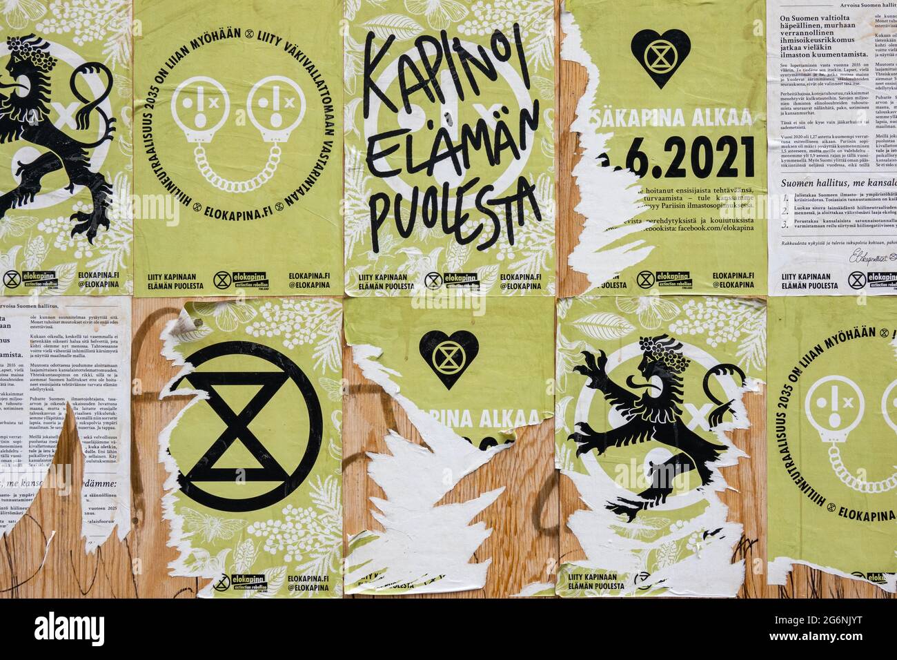 Torn Elokapina or Extinction Rebellion Finland posters in Helsinki, Finland Stock Photo