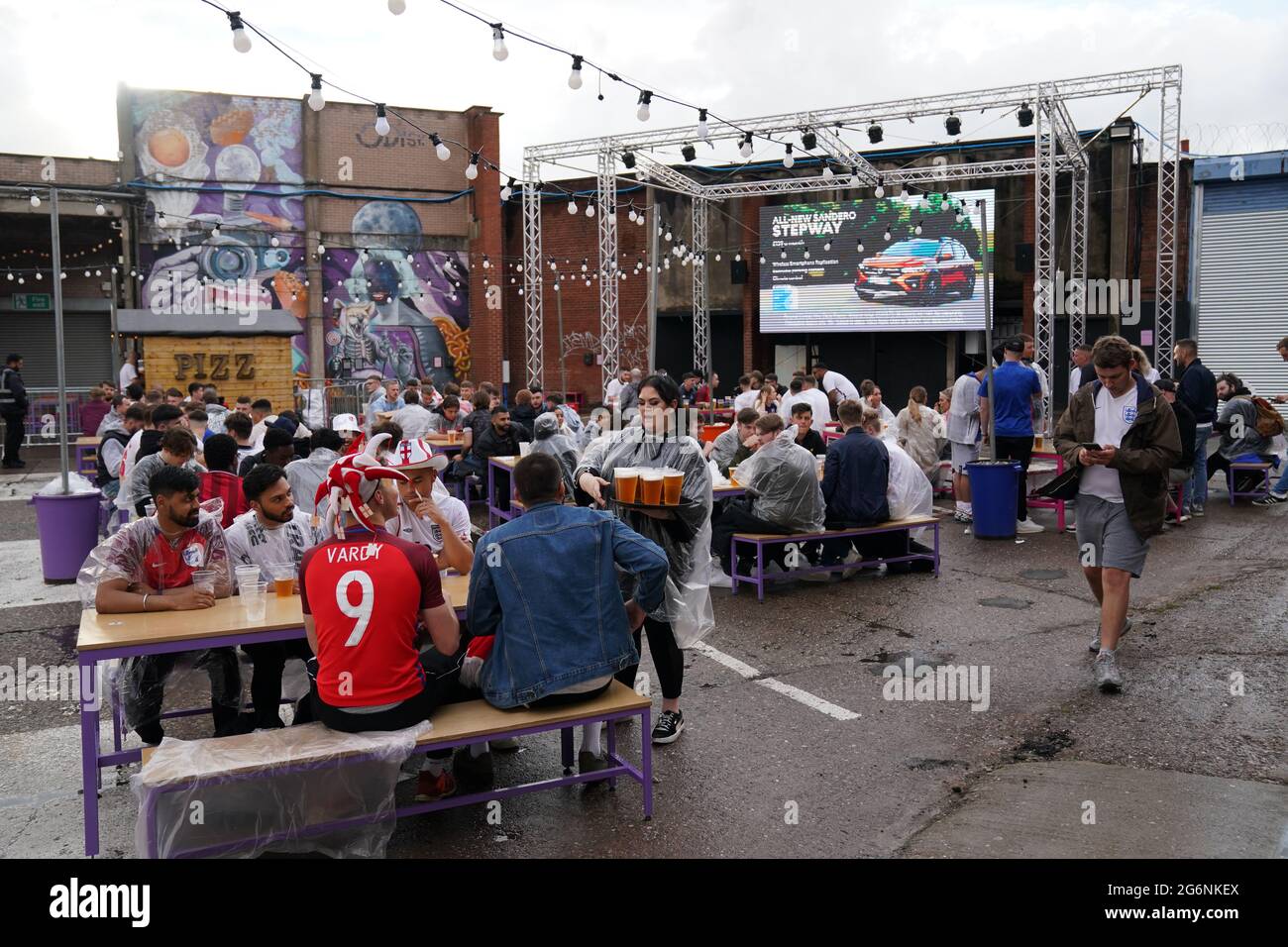 Fans at Luna Springs in Birmingham prepare to watch the Euro 2020 semi