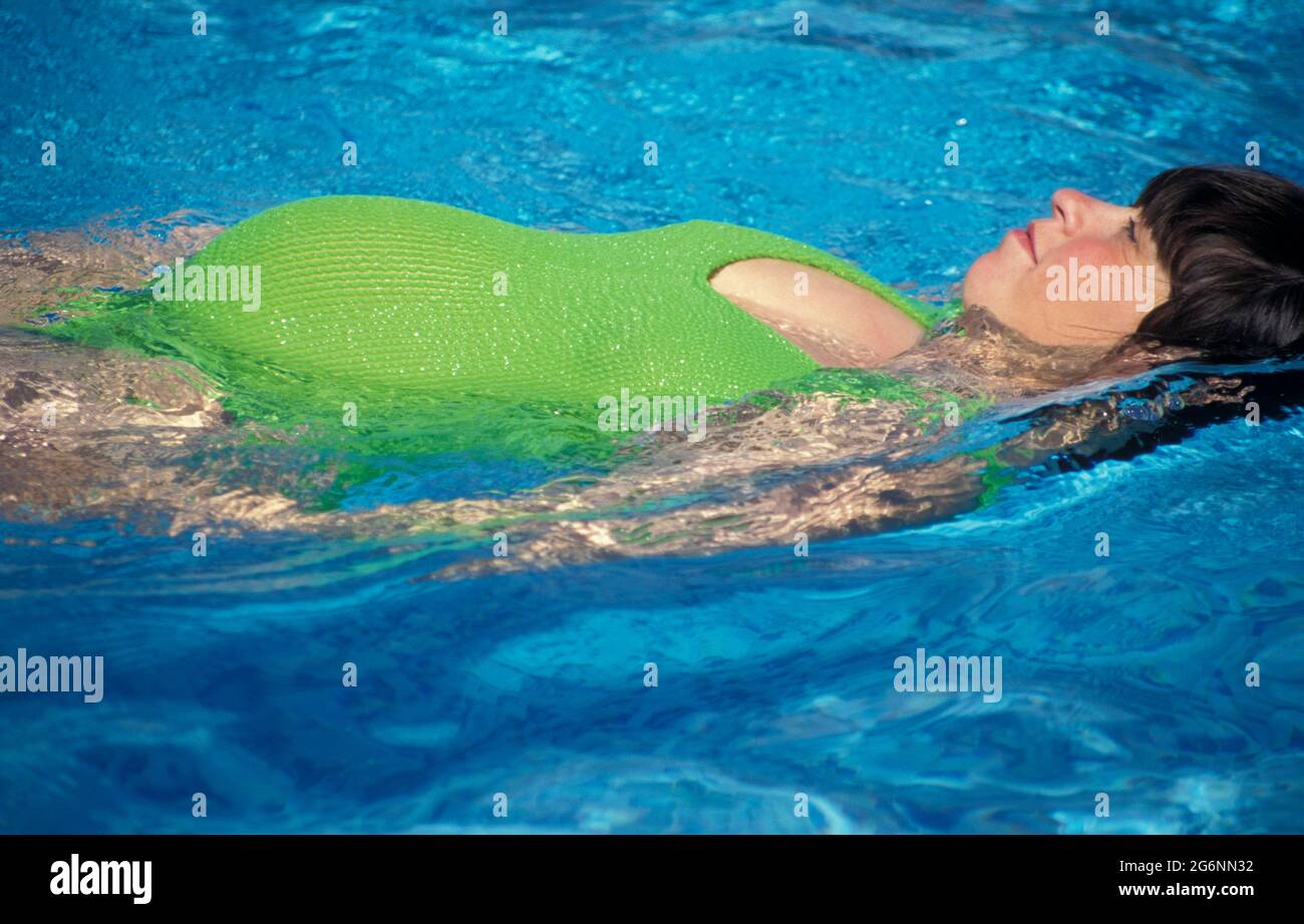 pregnant woman swimming Stock Photo