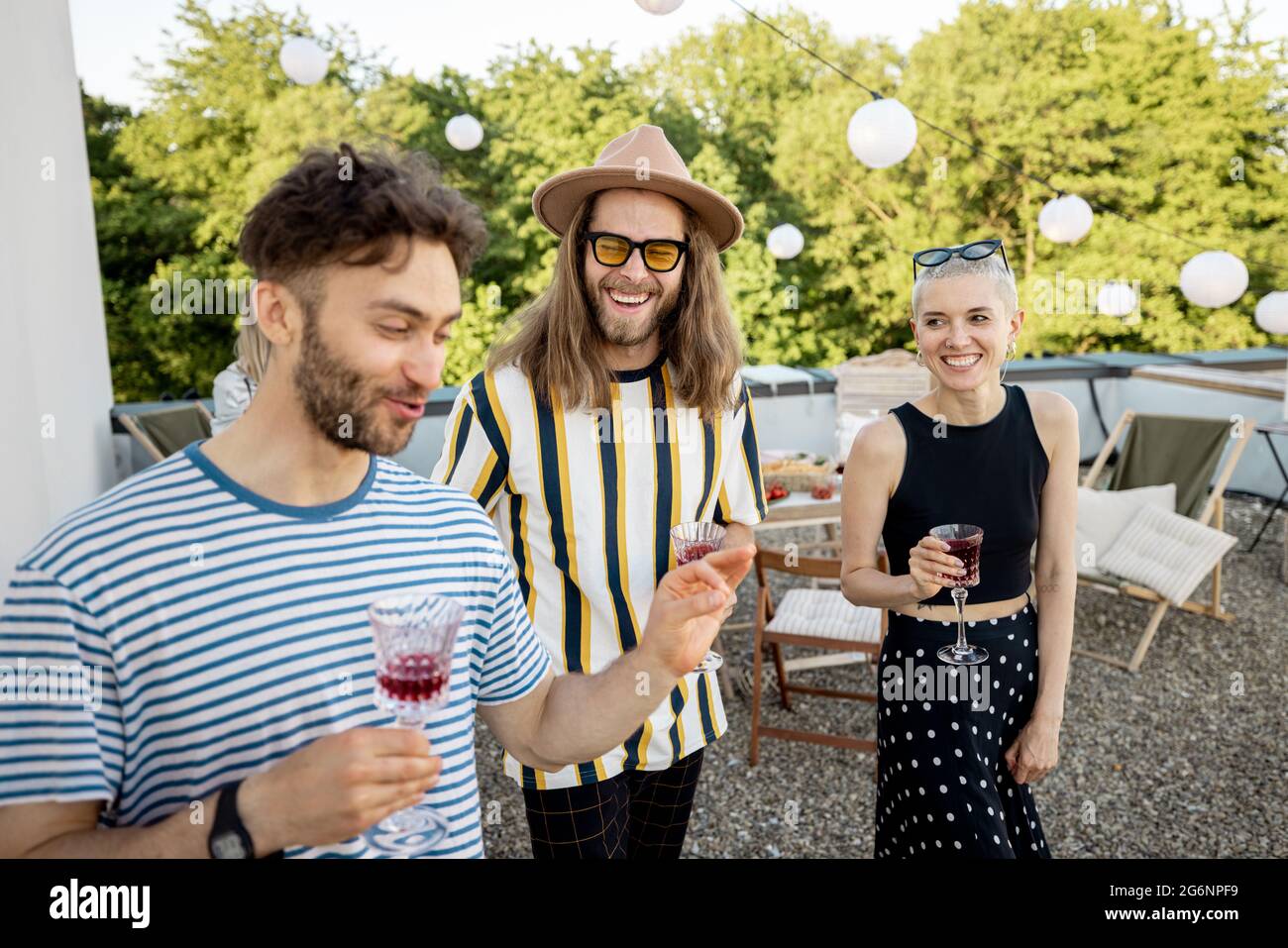Friends on a rooftop party Stock Photo