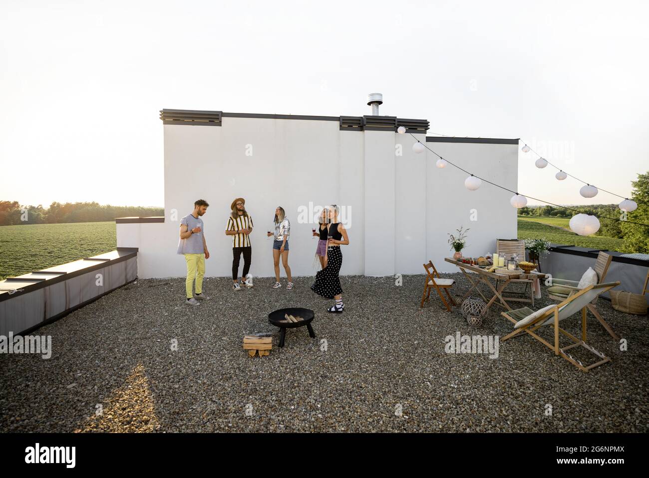 Stylish friends dancing at party outdoors Stock Photo