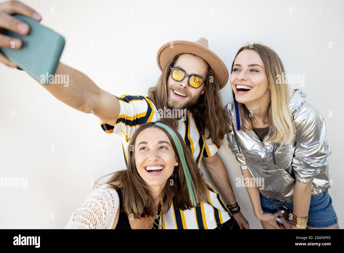 Stylish friends taking selfie photo on phone Stock Photo