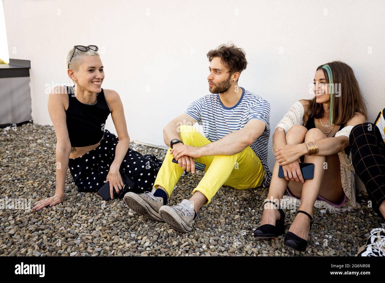 Friends talking outdoors Stock Photo