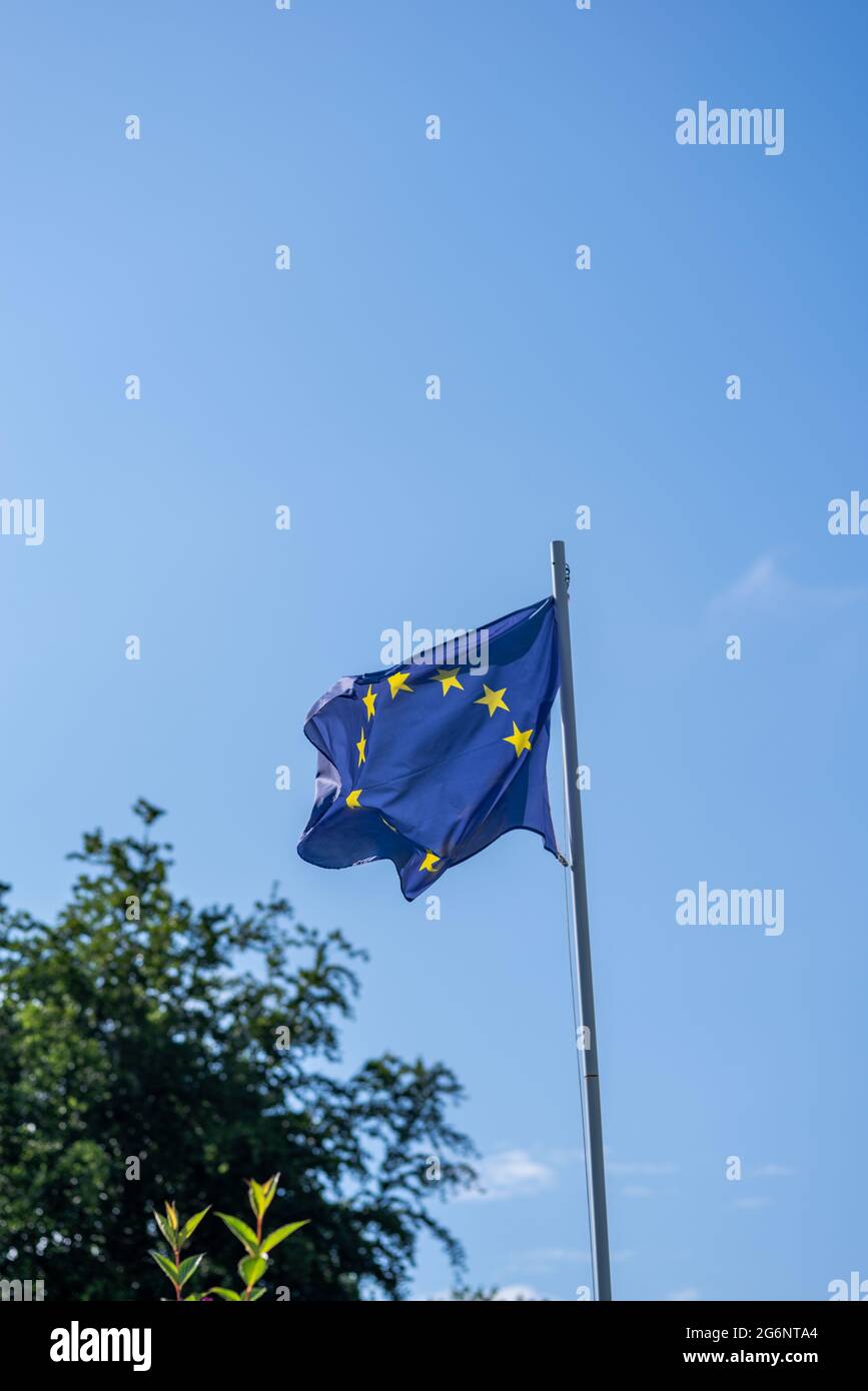 europe flag in the wind and blue sky Stock Photo Alamy