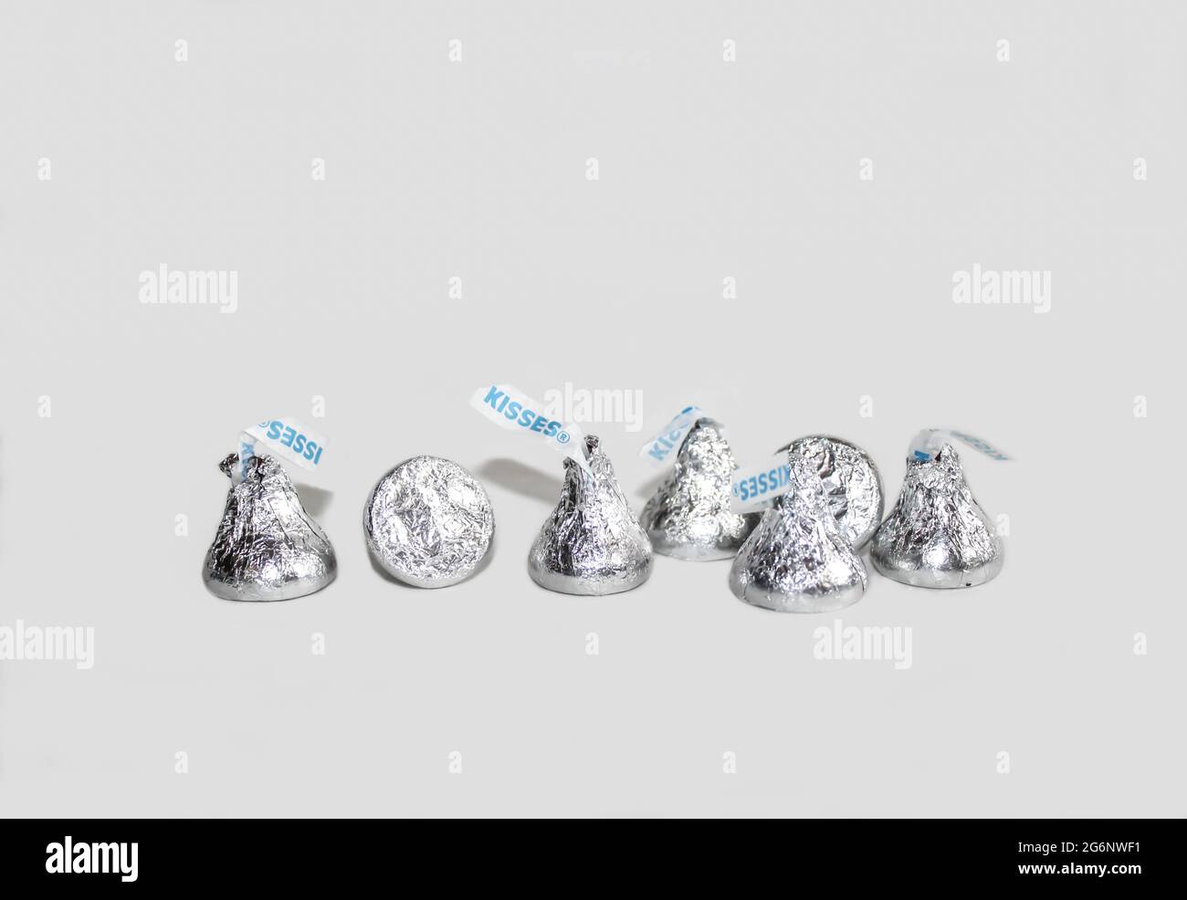 Silver Hershey's chocolate kisses isolated on a white background Stock Photo