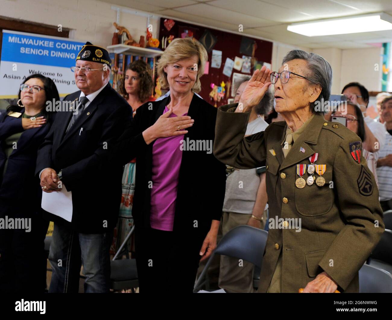 July 7, 2021, Milwaukee, Wisconsin, U.S: DR. DAVID TOY (right to left), U.S. SENATOR TAMMY BALDWIN, ALEX KOLANDER, Commander of American Legion Post 449, and regional representative to Baldwin, VANESSA L. LLANAS stand as they recited the Pledge of Allegiance during opening ceremony. U.S. Senator Tammy Baldwin, the Organization of Chinese Americans-Wisconsin Chapter and the Chinese Golden Age Club of Milwaukee honored.DR. DAVID TOY, 97, Wednesday July 7, 2021, as he receives the Chinese-American World War II Veteran Service Medal at the Chinese Community Baptist Church in Milwaukee. DR. DAVID Stock Photo