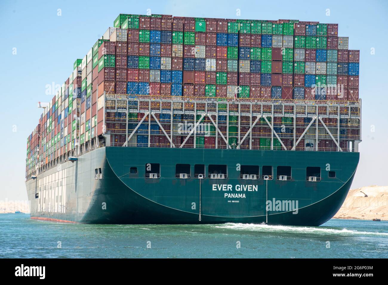 Suez Canal, Egypt - 7 July 2021 - The huge container ship Ever Given that blocked the Suez Canal in March 2021 is free at last and enroute to Rotterdam after a compensation agreement was made between the Suez Canal Authority and Shoei Kisen Kaisha, the Japanese ship owners. The SCA head Osama Rabie declared, "I announce to the world that we have reached a deal." The Ever Given was freed from blockage in a salvage operation that lasted 6 days, however in that short amount of time it created a traffic jam backlog of 420 ships at the chokepoint in just the first 4 days. Stock Photo