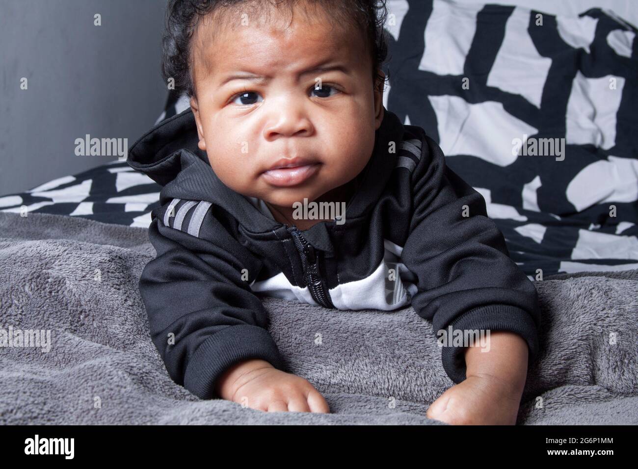 Charismatic 4 months old baby boy. A little toddler. Hip hop baby boy.  Portrait of a cute urban baby, wearing a grey adidas outfit Stock Photo -  Alamy