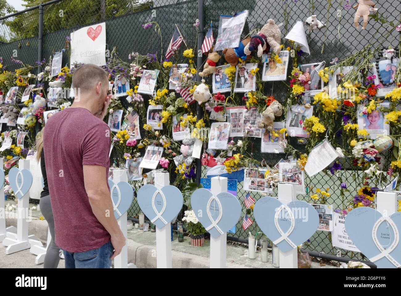 Surfside, United States. 07th July, 2021. A man reacts while looking at the missing victims at the memorial outside St. Joseph Catholic Church near the collapsed Champlain Towers South condo in Surfside, Florida on Wednesday, July 7, 2021. News reports said that 46 people have died since the collapse over week ago. Photo By Gary I Rothstein/UPI Credit: UPI/Alamy Live News Stock Photo