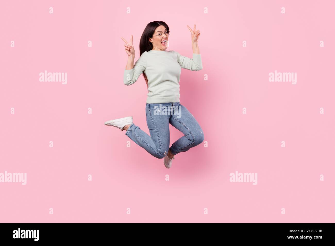 Full body photo of cheerful positive woman jump up air show v-sign good ...